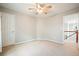 This bedroom has neutral paint, a ceiling fan, and carpeted floors at 616 Redwood Ln, Canton, GA 30114
