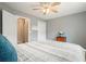 Bedroom with neutral carpet, ceiling fan, and two closets at 616 Redwood Ln, Canton, GA 30114