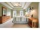 Inviting bedroom with tray ceilings, sconces, and neutral colors creating a soothing atmosphere at 616 Redwood Ln, Canton, GA 30114