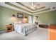 Relaxing bedroom with decorative pillows and a glimpse of the bathroom entrance at 616 Redwood Ln, Canton, GA 30114