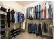 Spacious walk-in closet featuring ample hanging space, shelving, and organization for clothes and accessories at 616 Redwood Ln, Canton, GA 30114