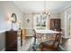 Charming dining room featuring hardwood floors, classic furniture, and bright natural lighting at 616 Redwood Ln, Canton, GA 30114