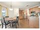Eat-in kitchen dining area with wooden floors, stainless appliances, and natural light at 616 Redwood Ln, Canton, GA 30114