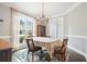 Cozy dining room with beautiful hardwood floors, large windows, and a traditional chandelier at 616 Redwood Ln, Canton, GA 30114