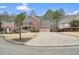 Charming two-story brick home featuring a two-car garage and long driveway at 616 Redwood Ln, Canton, GA 30114