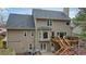 Back exterior view with deck and gray roof at 616 Redwood Ln, Canton, GA 30114