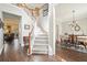 Bright foyer featuring hardwood floors, staircase, and access to dining and living areas at 616 Redwood Ln, Canton, GA 30114
