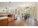 Bright kitchen features a copper farmhouse sink, stainless appliances, and wood-look tile flooring at 616 Redwood Ln, Canton, GA 30114