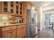 Kitchen showcases wooden cabinetry, stainless steel appliances and hardwood floors at 616 Redwood Ln, Canton, GA 30114