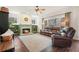 Inviting living room with a fireplace, built-in bookshelves, and a comfortable leather sofa at 616 Redwood Ln, Canton, GA 30114