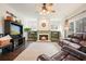 Cozy living room featuring a fireplace with built-ins, hardwood floors, and natural light at 616 Redwood Ln, Canton, GA 30114