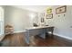 Well-lit office space with hardwood floors, neutral paint, and a large desk perfect for working from home at 616 Redwood Ln, Canton, GA 30114