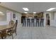 Finished basement featuring bar with seating, cabinetry, and dining area at 1615 Creek Pointe Cir, Lawrenceville, GA 30043