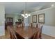 Elegant dining room with hardwood floors and large table perfect for Gathering gatherings and entertaining guests at 1615 Creek Pointe Cir, Lawrenceville, GA 30043