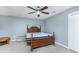 Bedroom with a ceiling fan, light blue walls and carpeted floor at 977 Forest Knoll Ct, Lithia Springs, GA 30122