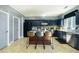 Modern kitchen with dark cabinets, stainless steel appliances, and a center island with seating at 977 Forest Knoll Ct, Lithia Springs, GA 30122
