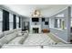 Comfortable living room featuring a fireplace, modern furniture, and an open layout for easy entertaining at 977 Forest Knoll Ct, Lithia Springs, GA 30122