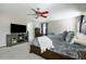 Comfortable main bedroom with a TV, soft carpet, and ample natural light at 977 Forest Knoll Ct, Lithia Springs, GA 30122