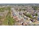 An aerial view showing rows of houses in a neighborhood with mature trees lining the streets at 2143 Great Shoals Cir, Lawrenceville, GA 30045
