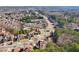 Captured from above, beautiful homes in a tree-lined community with views of recreational facilities at 2143 Great Shoals Cir, Lawrenceville, GA 30045