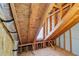 Exposed wooden beams and ductwork create an interesting pattern in the attic at 2143 Great Shoals Cir, Lawrenceville, GA 30045