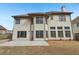 Large backyard features a concrete patio perfect for outdoor dining and entertaining at 2143 Great Shoals Cir, Lawrenceville, GA 30045
