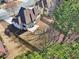 An aerial backyard view of fenced yard with a patio, well-maintained lawn, and mature trees at 2143 Great Shoals Cir, Lawrenceville, GA 30045