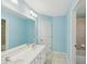 Bathroom featuring double sinks, a large mirror, and a separate shower and tub at 2143 Great Shoals Cir, Lawrenceville, GA 30045