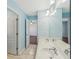 Bathroom featuring a double sink vanity and an open doorway at 2143 Great Shoals Cir, Lawrenceville, GA 30045