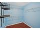 Walk-in closet with shelving and hardwood floors at 2143 Great Shoals Cir, Lawrenceville, GA 30045