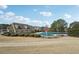 Community pool with mushroom water feature and well manicured landscaping at 2143 Great Shoals Cir, Lawrenceville, GA 30045
