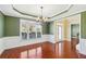 Dining room features a decorative chandelier, natural lighting, and entryway at 2143 Great Shoals Cir, Lawrenceville, GA 30045