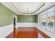 Formal dining room features a tray ceiling, chandelier and large windows at 2143 Great Shoals Cir, Lawrenceville, GA 30045
