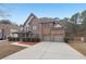 Beautiful two-story home with brick facade and attached two-car garage at 2143 Great Shoals Cir, Lawrenceville, GA 30045