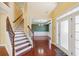 Welcoming foyer showcasing hardwood floors and staircase at 2143 Great Shoals Cir, Lawrenceville, GA 30045