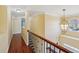 Hallway with hardwood floors and decorative lighting at 2143 Great Shoals Cir, Lawrenceville, GA 30045
