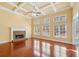 Bright living room with coffered ceiling, fireplace, and large windows at 2143 Great Shoals Cir, Lawrenceville, GA 30045