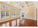 Spacious living room with hardwood floors, coffered ceilings, and large windows at 2143 Great Shoals Cir, Lawrenceville, GA 30045