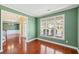 Bright living room features large windows, hardwood floors, and neutral paint at 2143 Great Shoals Cir, Lawrenceville, GA 30045