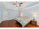 Bright and airy main bedroom with a tray ceiling, hardwood floors, and ensuite access at 2143 Great Shoals Cir, Lawrenceville, GA 30045