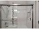 Bright bathroom walk-in shower with glass doors, and a built-in shampoo nook at 2657 Lenox Rd # C30, Atlanta, GA 30324