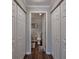 Bathroom hallway featuring closets with mirrored doors, and an open view of the toilet at 2657 Lenox Rd # C30, Atlanta, GA 30324