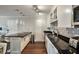 Modern kitchen with breakfast bar, granite countertops, stainless steel appliances, and stylish backsplash at 2657 Lenox Rd # C30, Atlanta, GA 30324