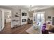 Contemporary living room features a modern fireplace, bar area, and balcony access at 2657 Lenox Rd # C30, Atlanta, GA 30324