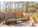 Fenced backyard featuring a pet-friendly deck and stone-paved ground, perfect for outdoor enjoyment and relaxation at 3293 Pennington Dr, Stonecrest, GA 30038