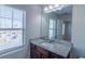 Bathroom view towards granite countertop vanity and window at 3293 Pennington Dr, Stonecrest, GA 30038