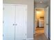Bedroom offering carpeted floors and a closet with double doors that leads to the laundry room at 3293 Pennington Dr, Stonecrest, GA 30038