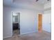 Bedroom view towards attached bathroom and closet door at 3293 Pennington Dr, Stonecrest, GA 30038