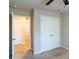 View of bedroom featuring a ceiling fan, carpeted floors, and closet with double doors at 3293 Pennington Dr, Stonecrest, GA 30038