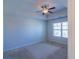 Neutral bedroom featuring carpet, a ceiling fan, and a window providing natural light at 3293 Pennington Dr, Stonecrest, GA 30038